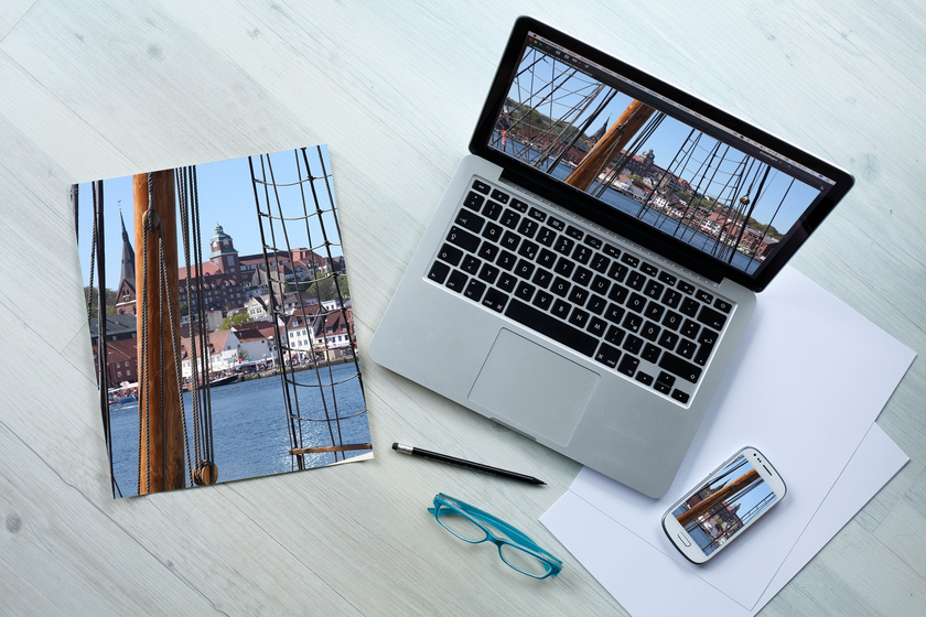 Top View of a Laptop and Magazines on a Desk